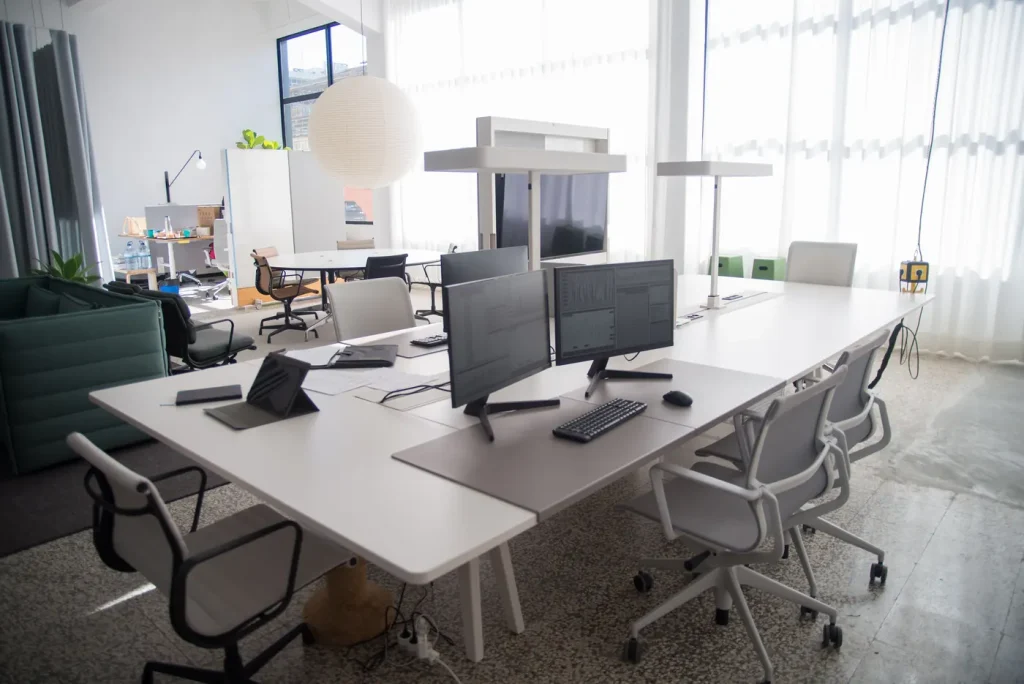 Open plan office desks with monitors