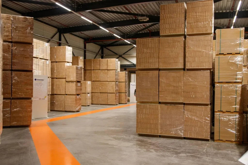 Cardboard boxes stacked on pallets in a warehouse