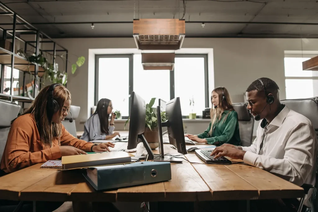 Office team working at shared desks